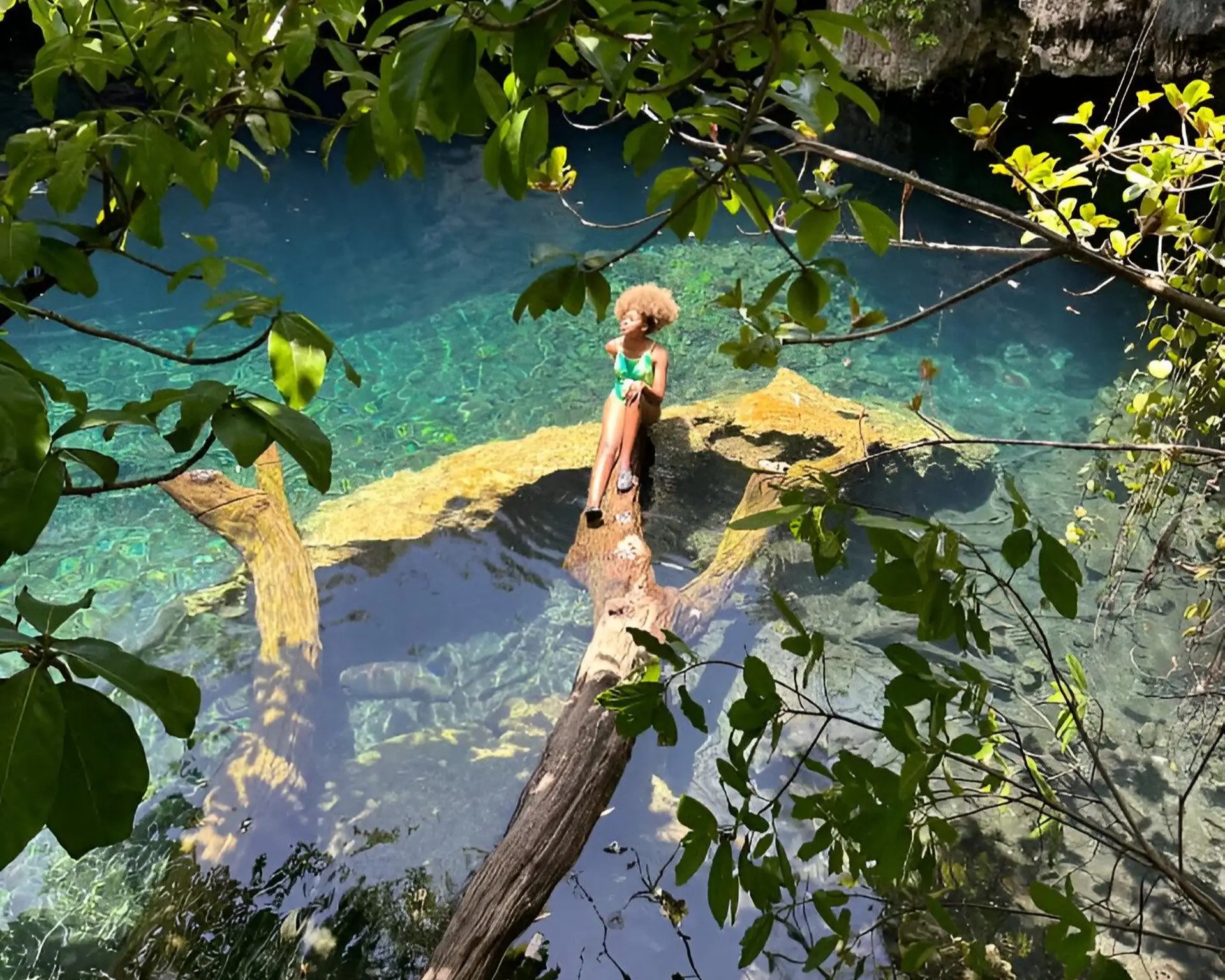 Maalum Cave with crystal-clear waters and mystical limestone formations in Zanzibar