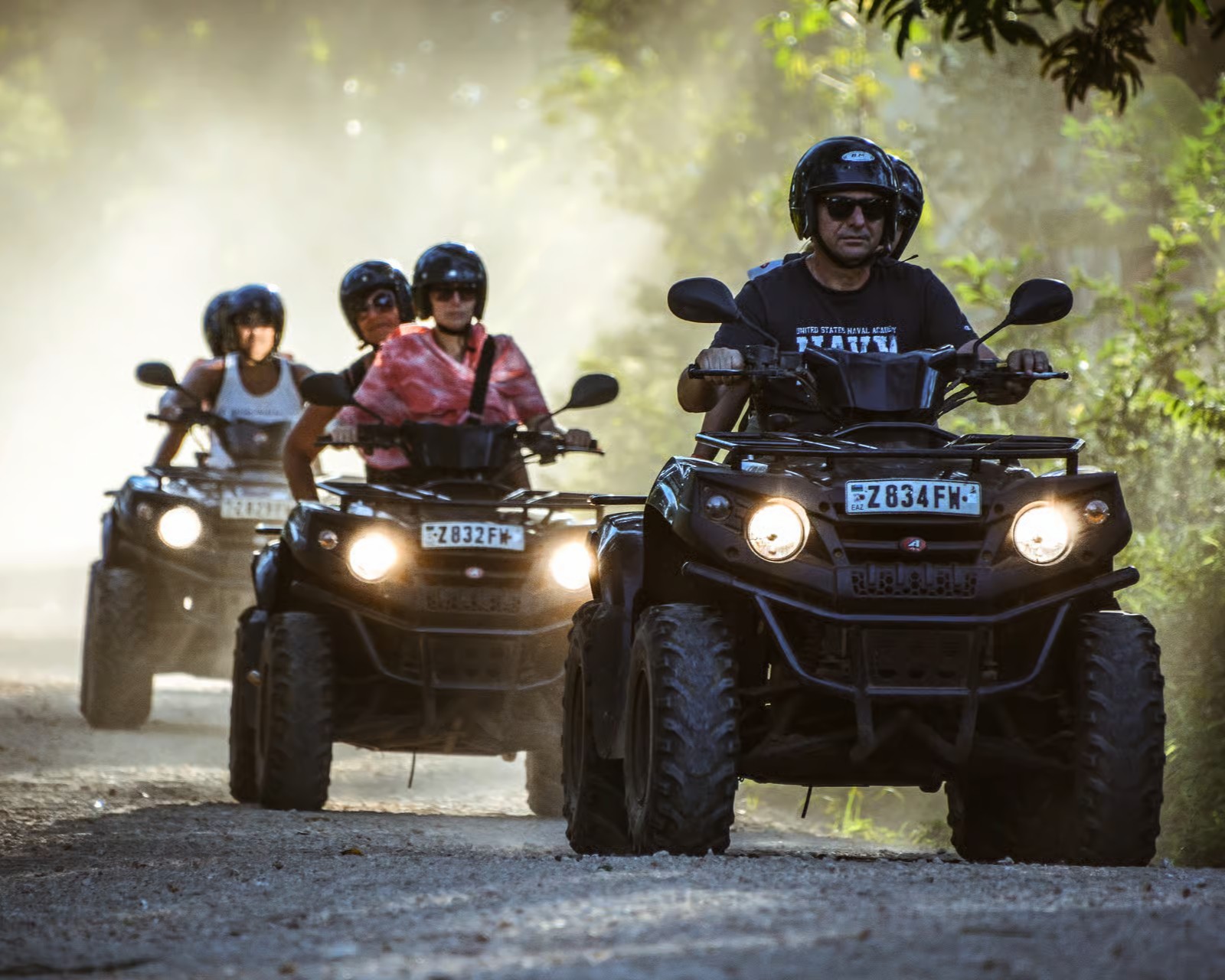 Quad bike rider exploring sandy dunes in Zanzibar during adventure tour